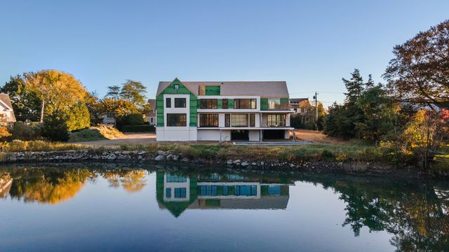 a house view with a lake view