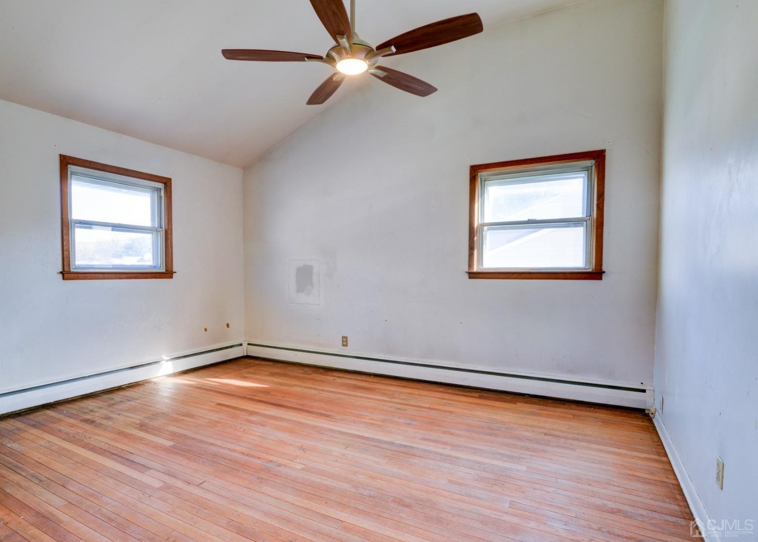 537 Ford Avenue Fords, NJ 08863 - Photo 15 of 31 wooden floor in an empty room with a window