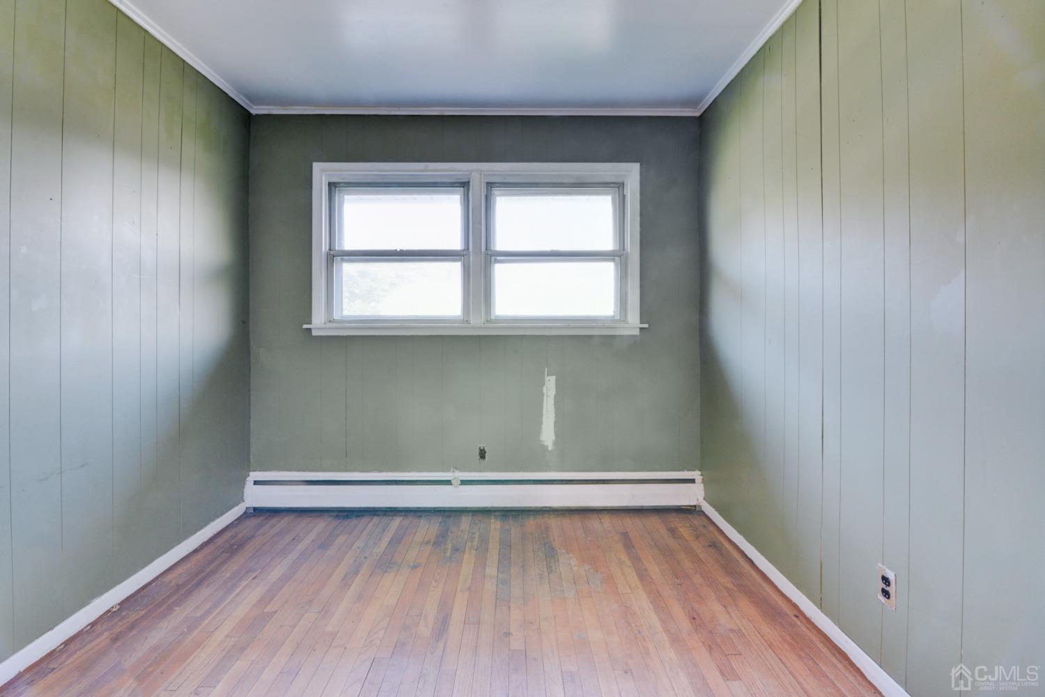 537 Ford Avenue Fords, NJ 08863 - Photo 17 of 31 wooden floor in an empty room with a window