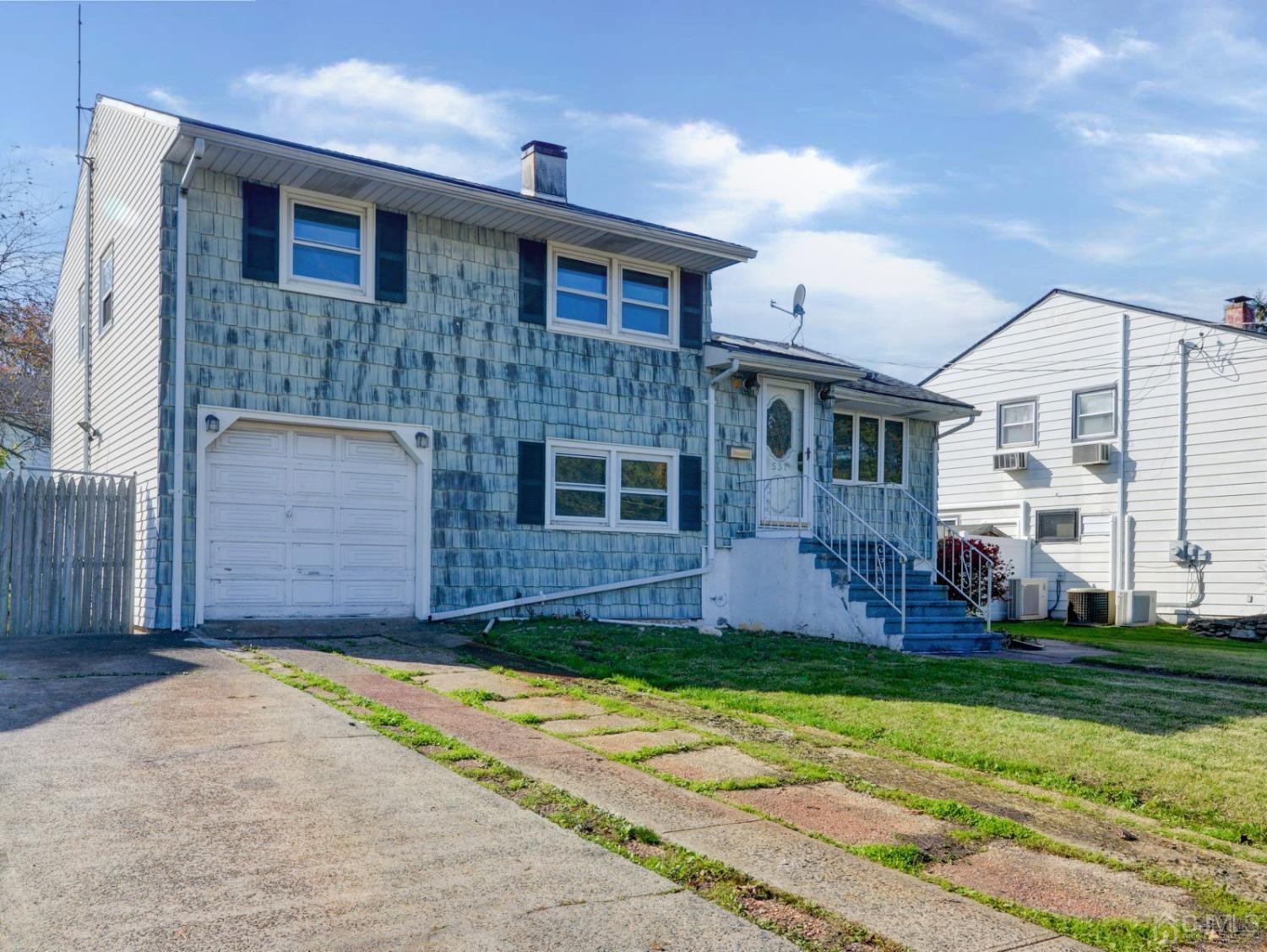 537 Ford Avenue Fords, NJ 08863 - Photo 2 of 31 a front view of a house with a yard