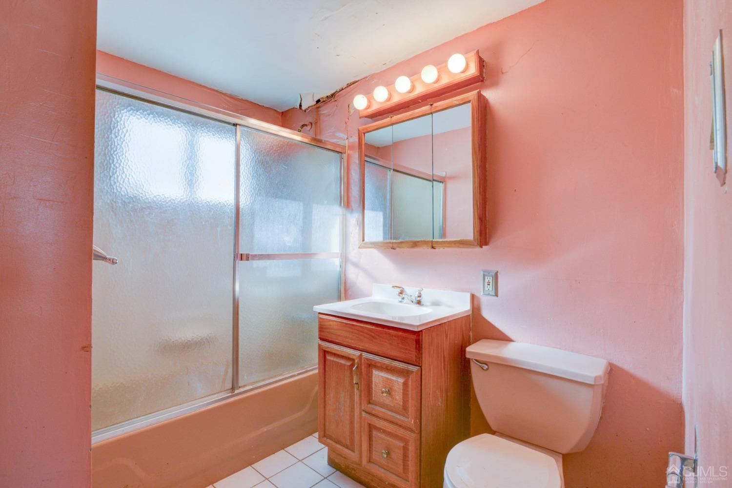 537 Ford Avenue Fords, NJ 08863 - Photo 25 of 31 a bathroom with a toilet sink and mirror