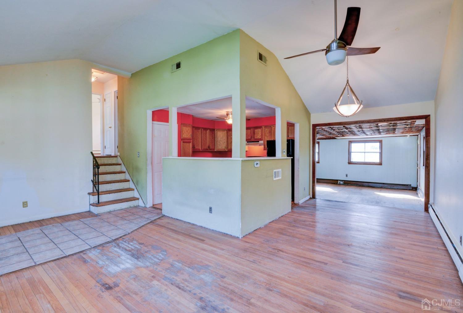 537 Ford Avenue Fords, NJ 08863 - Photo 5 of 31 a view of a room with wooden floor ceiling fan and windows