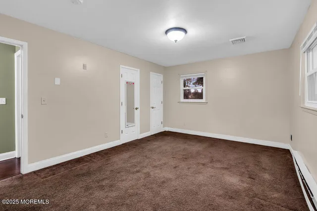 an empty room with a hallway