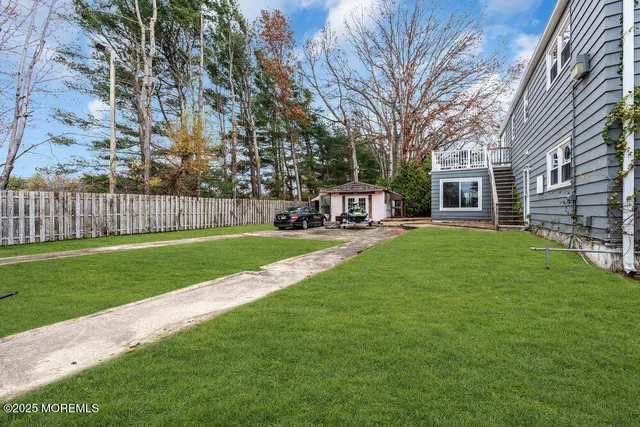 a house view with a sitting space and garden