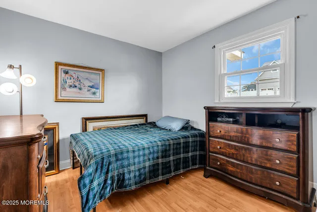 a bedroom with a bed and cabinet