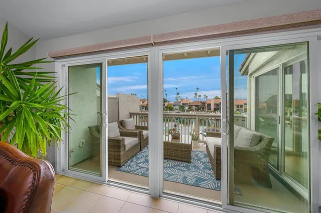 a room with balcony and furniture
