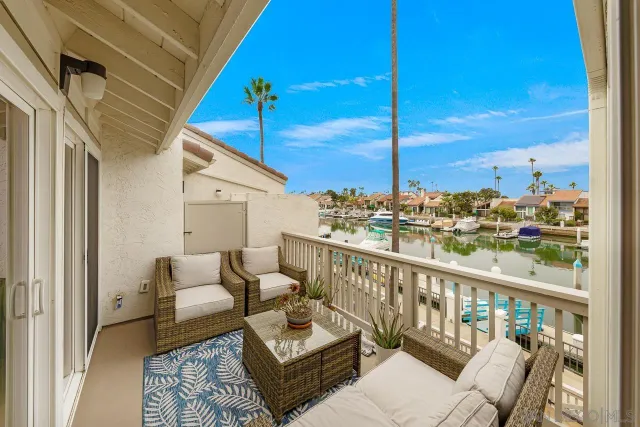 a view of balcony with couch and chairs
