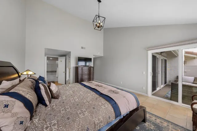 a bedroom with a bed and a view of bedroom