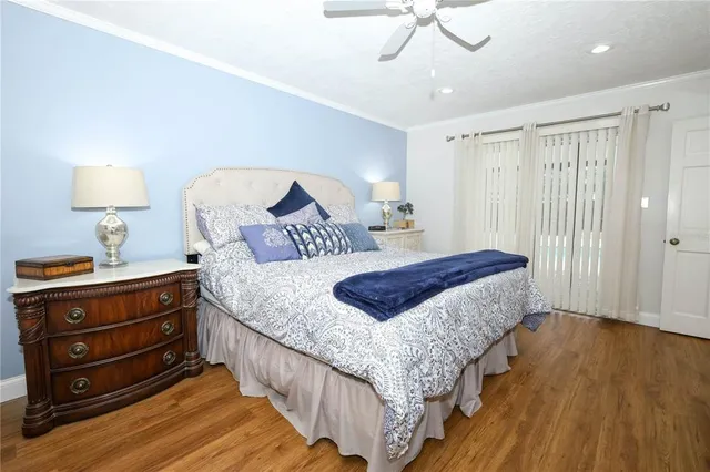 a bedroom with bed and window