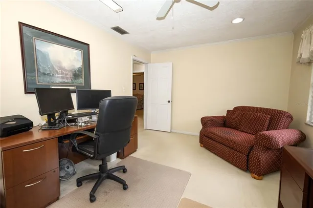 a work room with furniture and a window