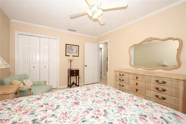 a bedroom with a bed and a dresser in it