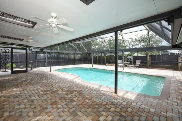 a view of a backyard with porch and a garden