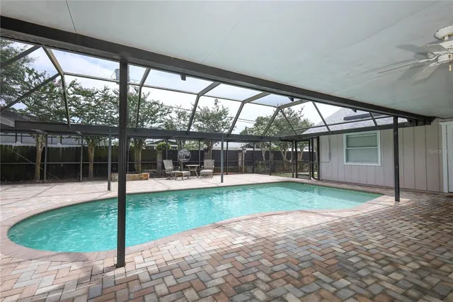 a view of swimming pool with a patio