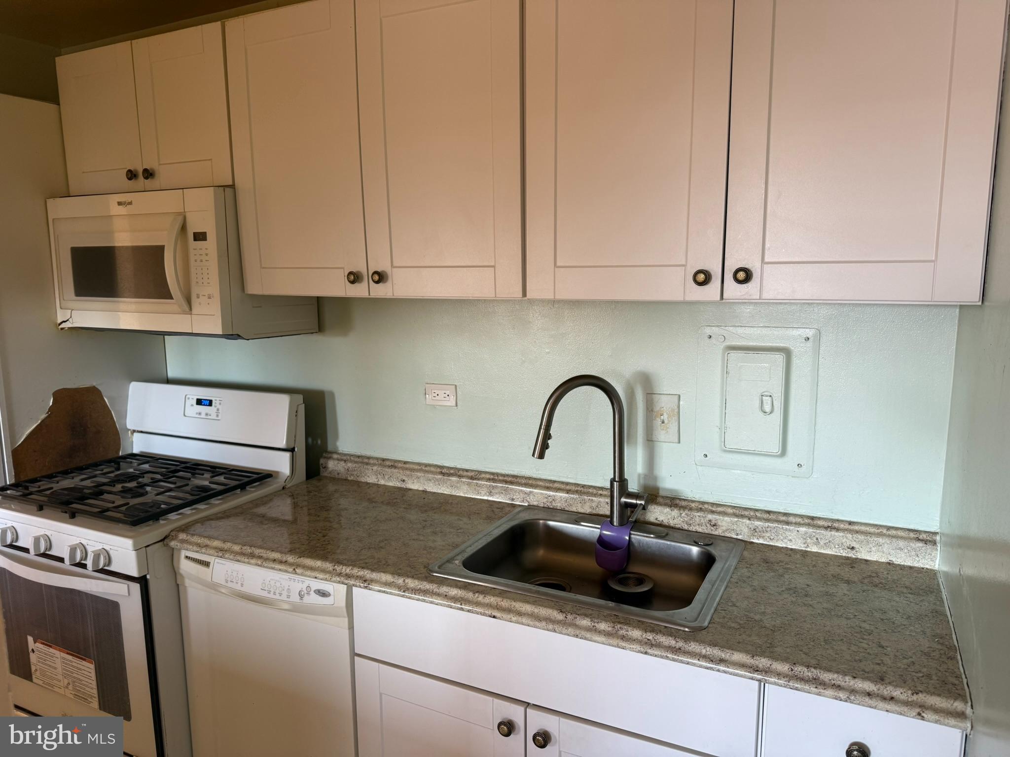 5340 Holmes Run Parkway, Unit 1215 Alexandria, VA 22304 - Photo 7 of 14 a kitchen with stainless steel appliances granite countertop a sink a stove and cabinets