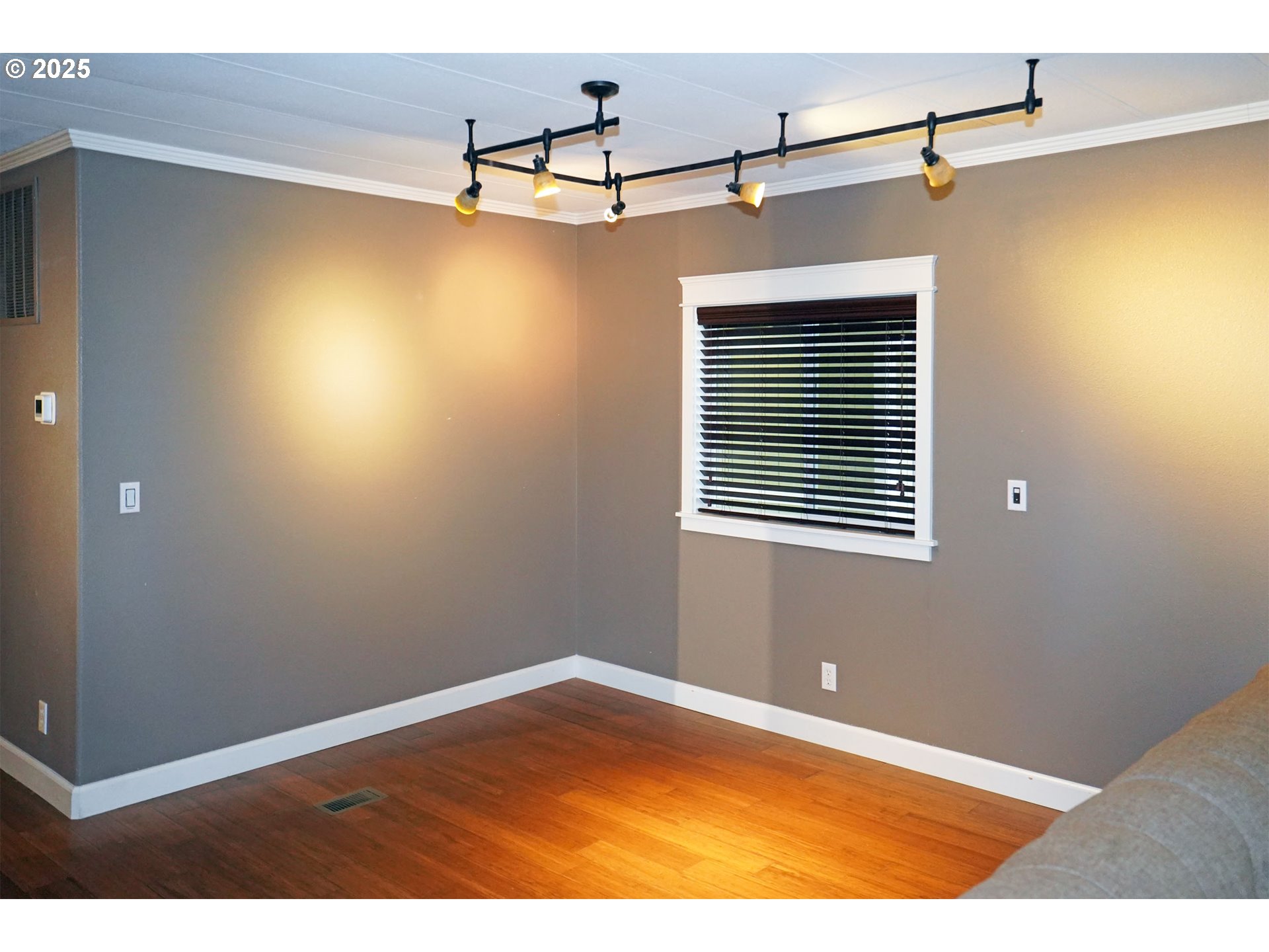 15411 Southeast Mill Plain Boulevard, Unit D3 Vancouver, WA 98684 - Photo 7 of 23 a view of a room with a window and hardwood floor