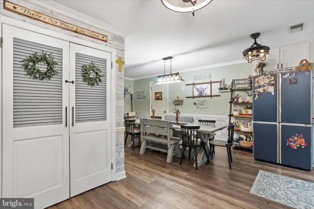 a view of a dining area with furniture window and wooden floor