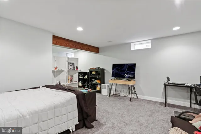 a bed room with a bed and a chair