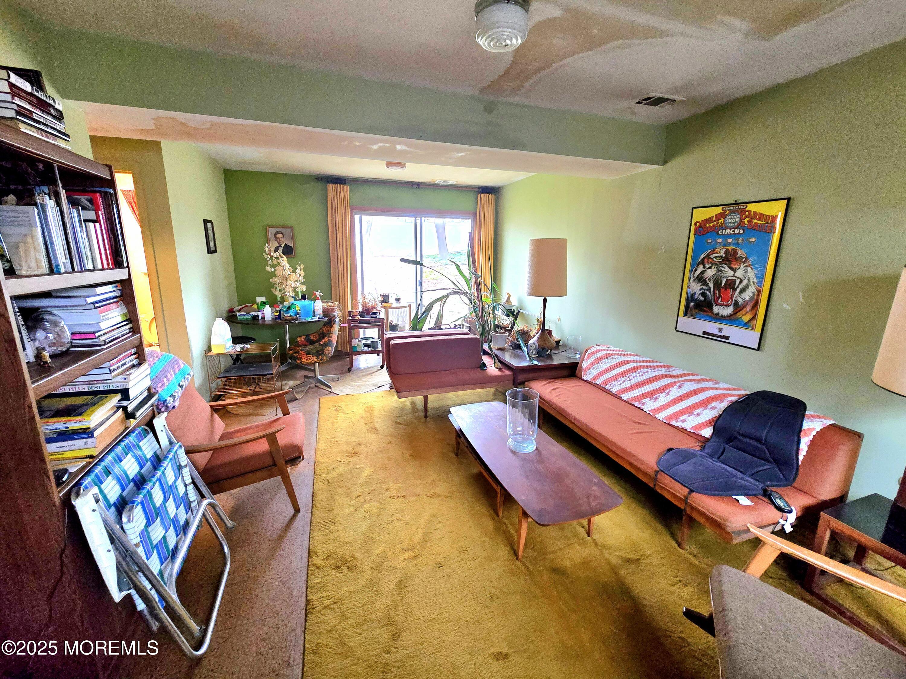 588 Pennsylvania Avenue Brick, NJ 08724 - Photo 25 of 30 a living room with furniture and a book shelf