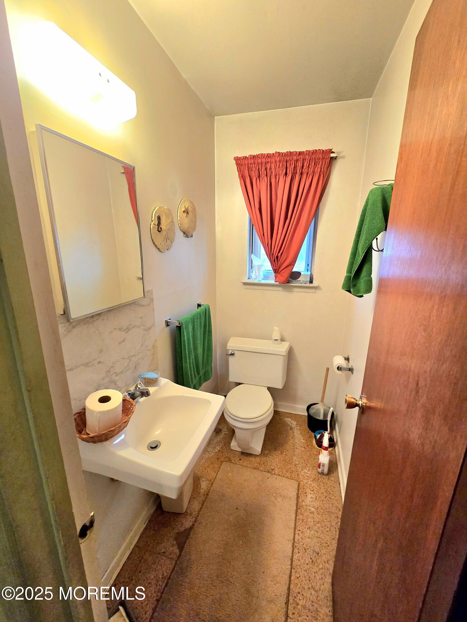588 Pennsylvania Avenue Brick, NJ 08724 - Photo 26 of 30 a bathroom with a sink and mirror with toilet