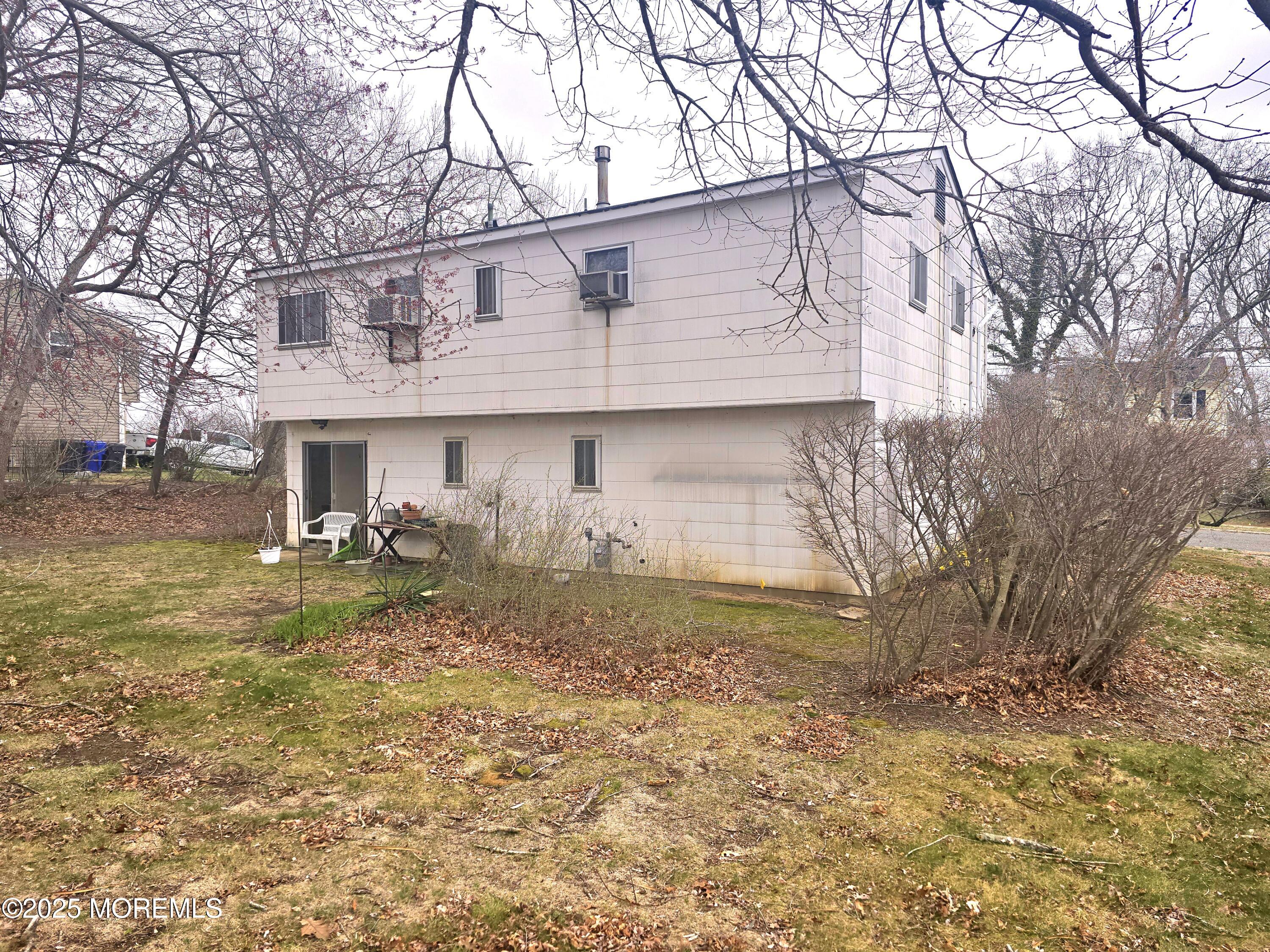 588 Pennsylvania Avenue Brick, NJ 08724 - Photo 4 of 30 a view of a yard in front of a house with a large tree
