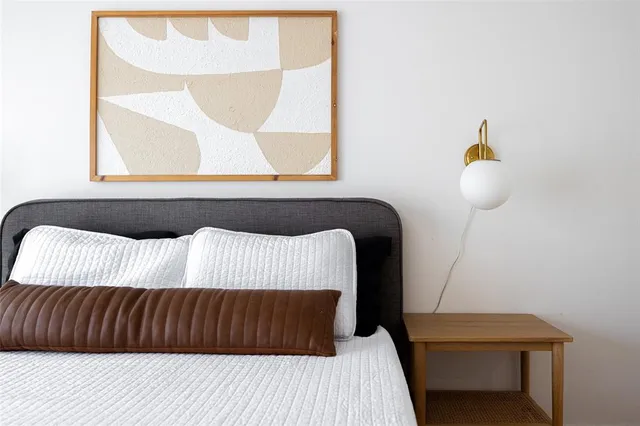 a bedroom with a bed and window