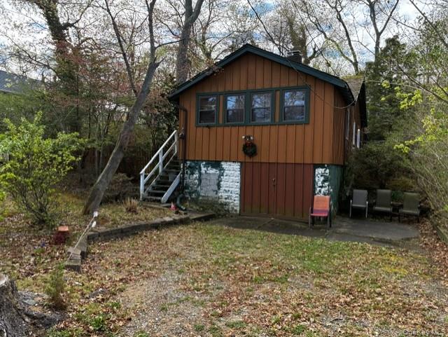 40 Hawthorne Road Rocky Point, NY 11778 - Photo 4 of 19 a front view of a house with a yard