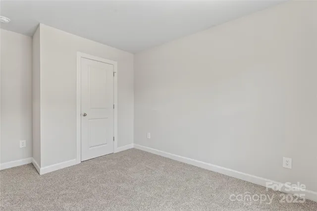 a bathroom with a toilet a sink and a mirror