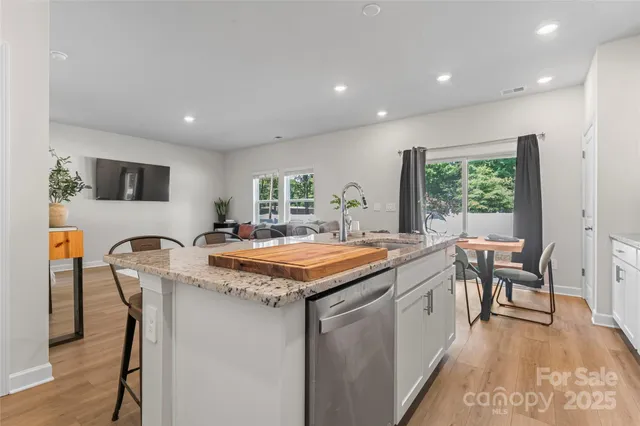 a kitchen with a table and chairs in it