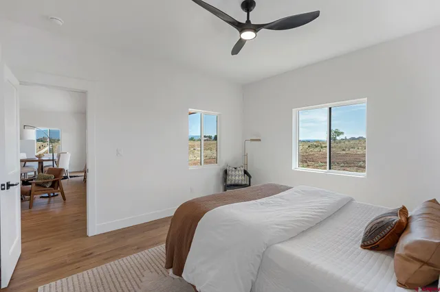 a bathroom with a double vanity sink mirror and shower
