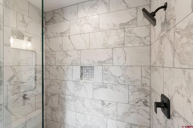 a view of a room with shelf on the wall