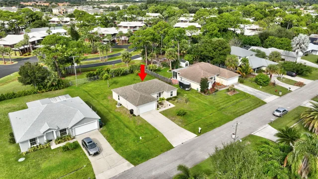 an aerial view of a house with outdoor space patio and outdoor seating