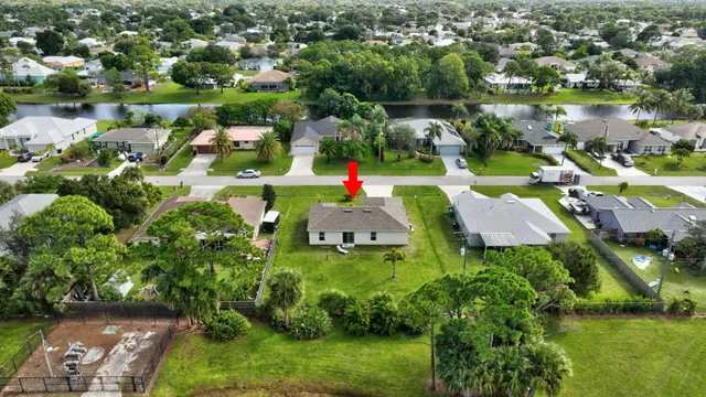 an aerial view of a houses with outdoor space and street view