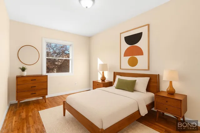 a bedroom with a bed and a dresser