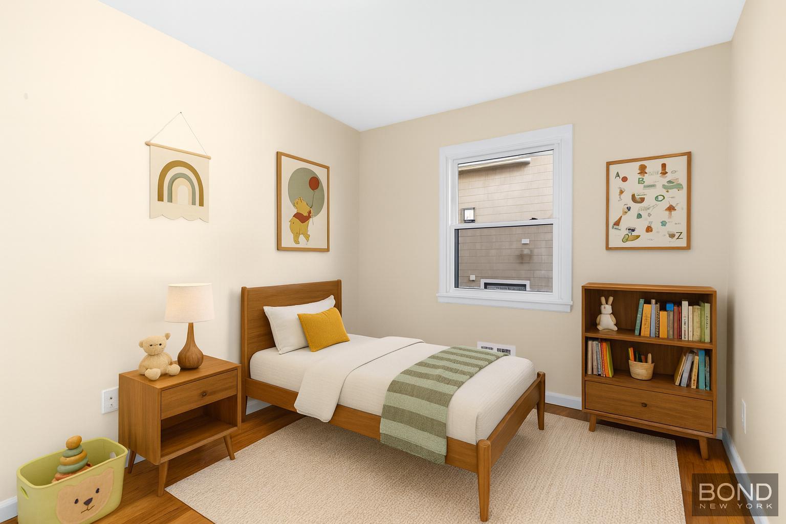 15-47 209th Street Queens, NY 11360 - Photo 7 of 11 a bedroom with a bed and a window