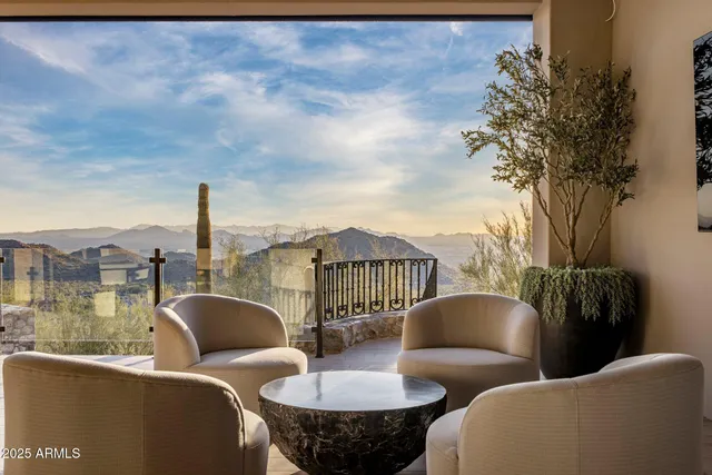 a view of a terrace with couches and sky view
