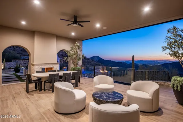 a view of a terrace with couches and sky view