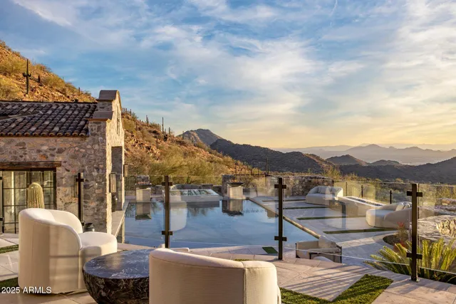 a spacious bedroom with a large bed and a large window