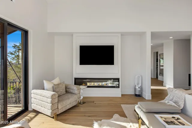 a spacious bathroom with a shower a sink and mirror