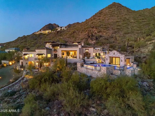 a view of a large building with a mountain in front of it