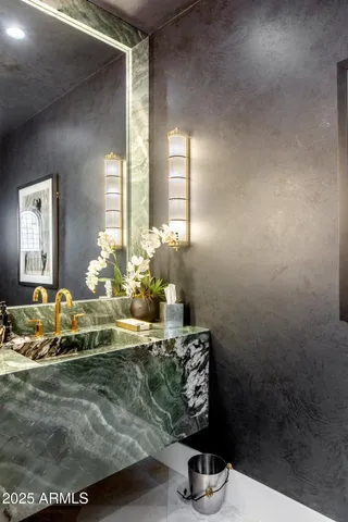 a kitchen with stainless steel appliances granite countertop a sink a counter space and cabinets