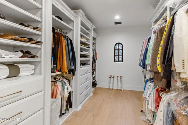 a bathroom with a granite countertop sink mirror and vanity
