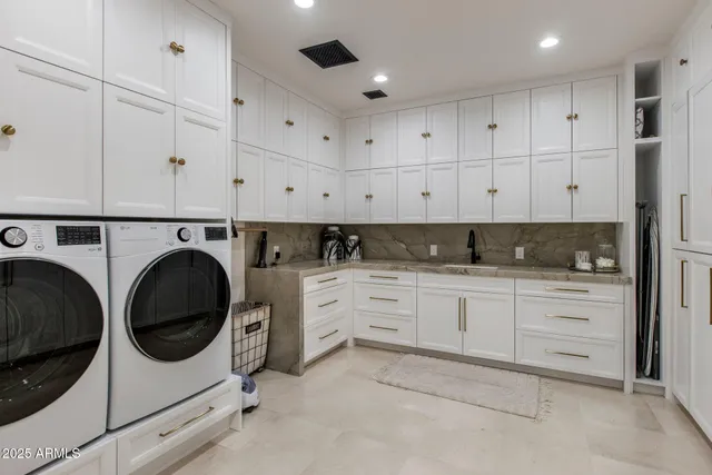a view of roof deck with couches and wooden floor