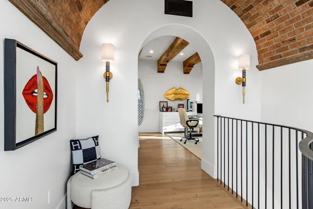a view of staircase with a floor to ceiling window and wooden floor