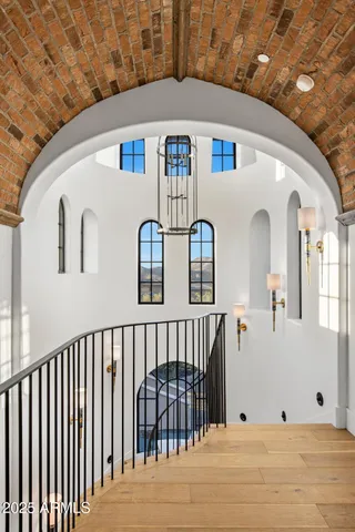 a lobby with furniture and flat screen tv