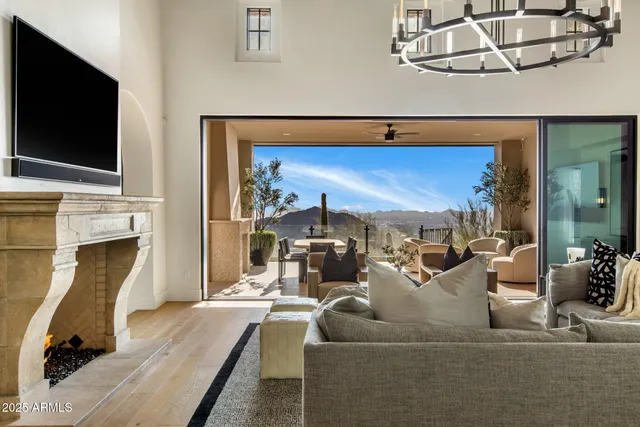 a living room with furniture fireplace and flat screen tv