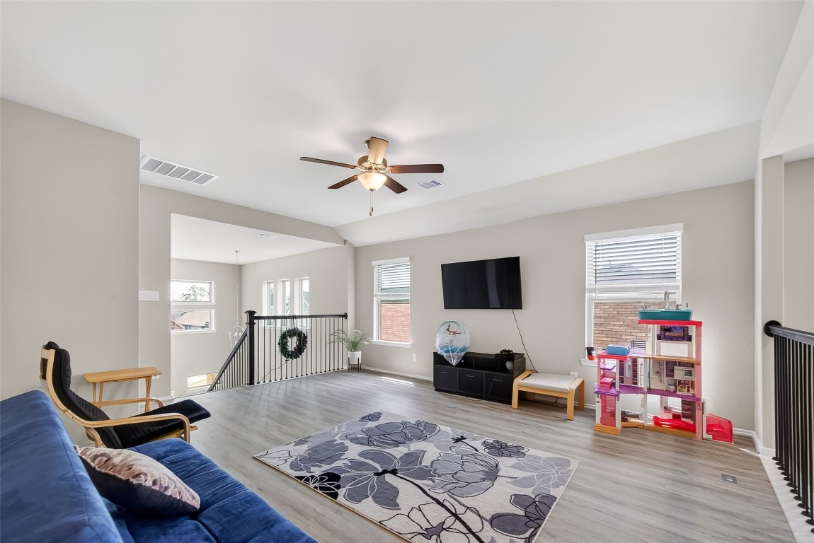 2739 Meadow View Lane Conroe, TX 77385 - Photo 18 of 50 a living room with furniture and a flat screen tv