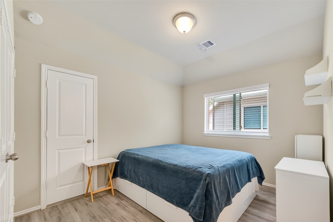 2739 Meadow View Lane Conroe, TX 77385 - Photo 19 of 50 a bedroom with a bed and a window