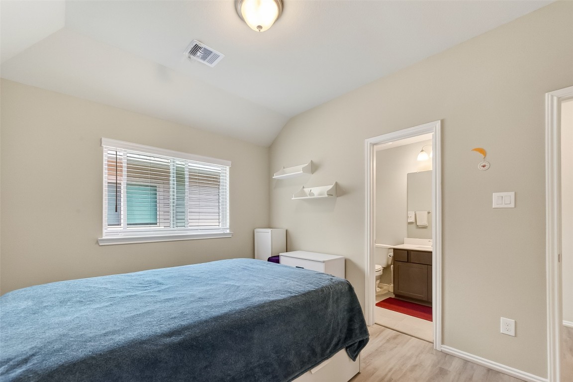 2739 Meadow View Lane Conroe, TX 77385 - Photo 20 of 50 a bedroom with a bed and a window