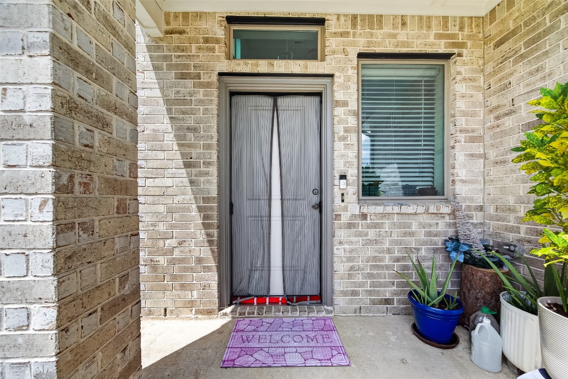 2739 Meadow View Lane Conroe, TX 77385 - Photo 2 of 50 a front view of a house with a potted plants
