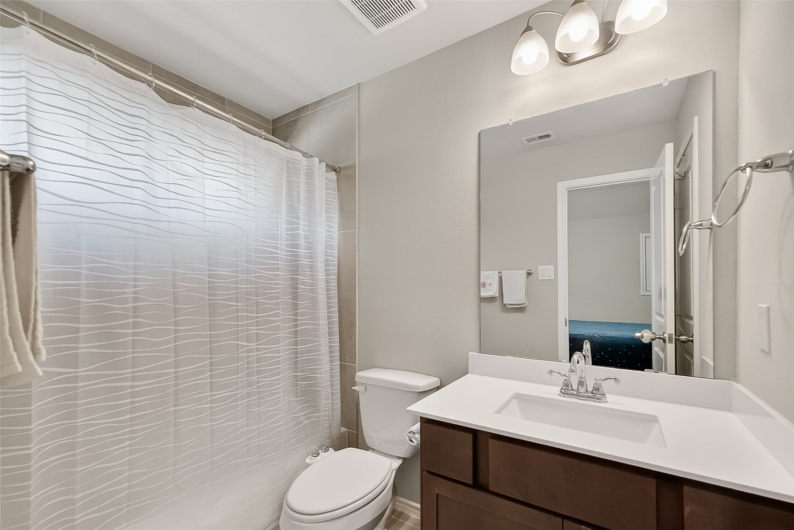 2739 Meadow View Lane Conroe, TX 77385 - Photo 22 of 50 a bathroom with a sink a toilet and shower